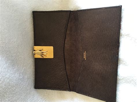 vintage gucci wallet with hand clasp